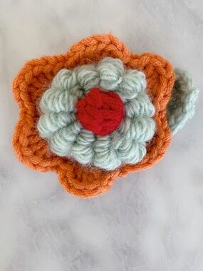 Introducing a piece of unique, wearable art: a 3D handmade crochet flower brooch